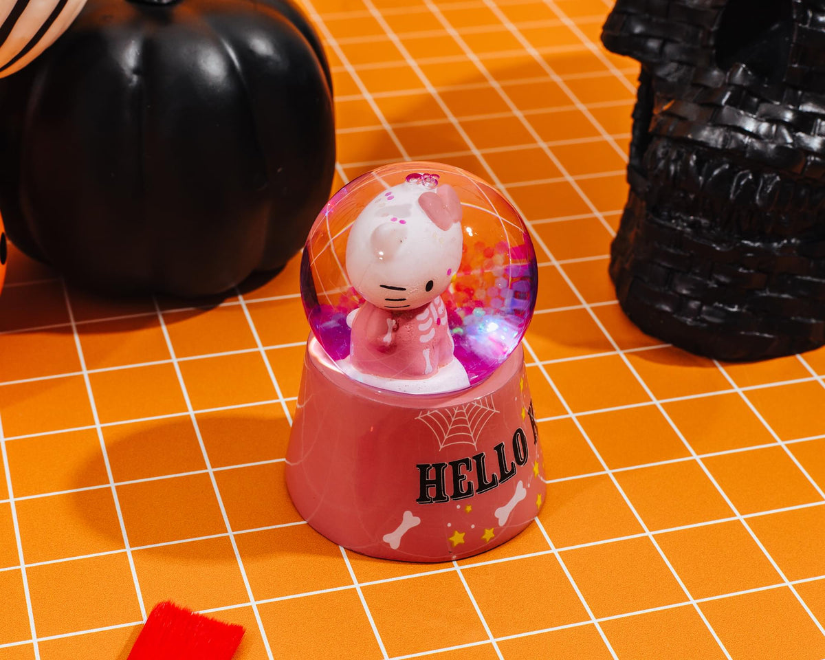Sanrio Hello Kitty Pink Skeleton 3-Inch Mini Light-Up Snow Globe