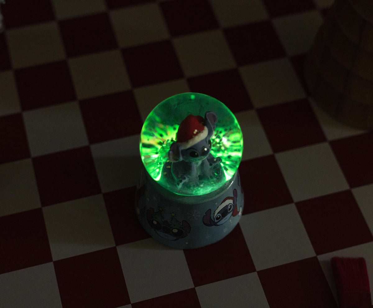 Disney Lilo & Stitch Santa Stitch 3-Inch Mini Light-Up Snow Globe